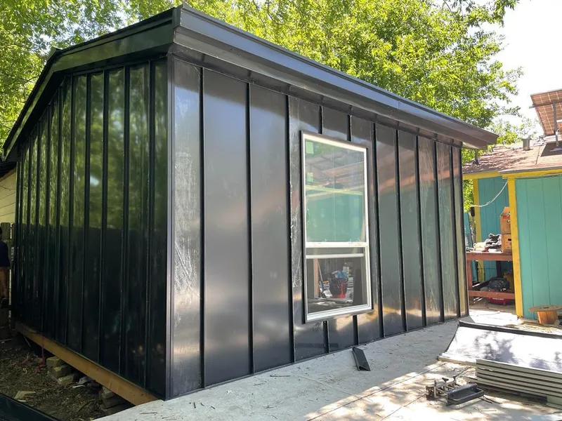 Black standing seam metal wall panels for Roof Inspection in Myrtle Grove