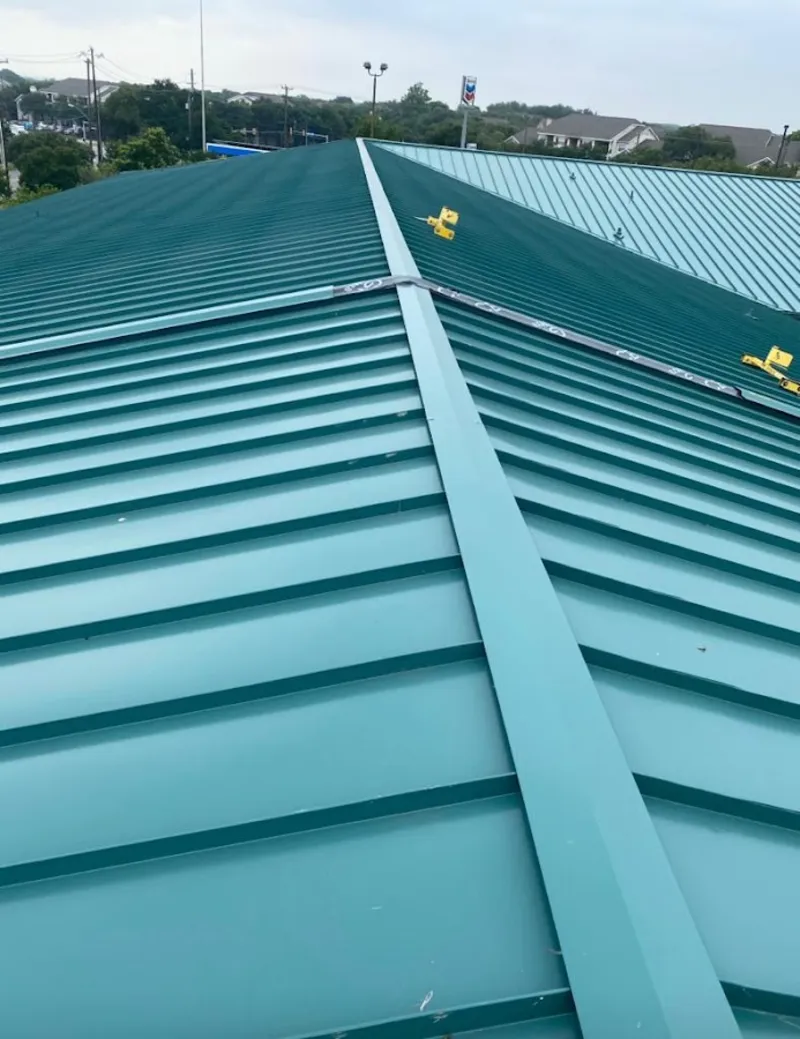 Green commercial metal roof ridge and valley for Metal Roof Repair in Myrtle Grove